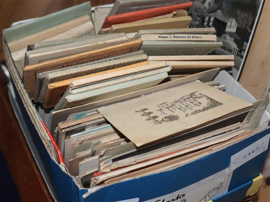 A postcard album and a collection of loose postcards and travel cards